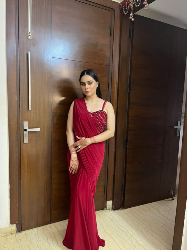 Crimson Grace: Red Drape Saree with Handcrafted Blouse Embellishments