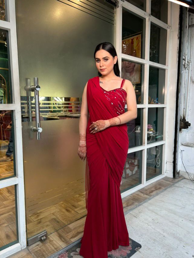 Crimson Grace: Red Drape Saree with Handcrafted Blouse Embellishments